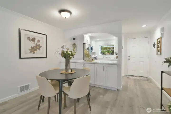 Dining area with pass-through to kitchen. Plus lots of cabinetry for extra storage.