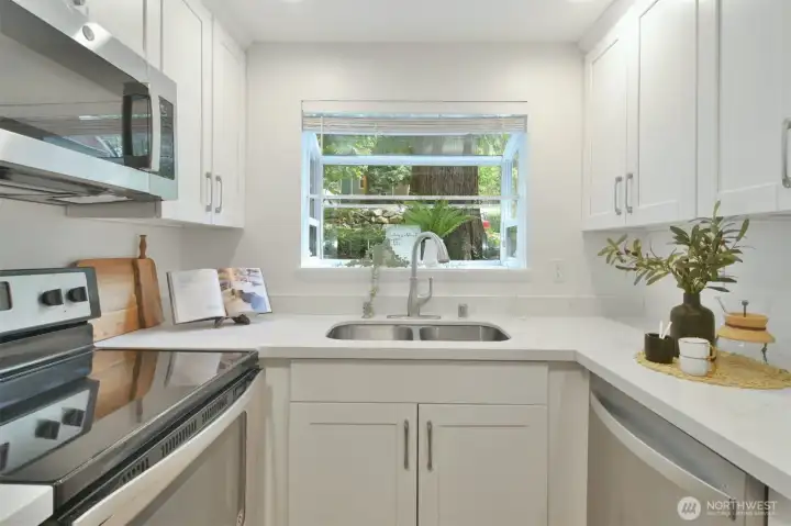 Enjoy your own personal zen space, featuring a garden window perfect for cultivating fresh herbs and completing your culinary creations.