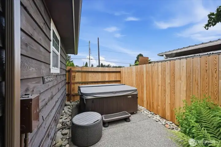 Hot tub privately tucked away.