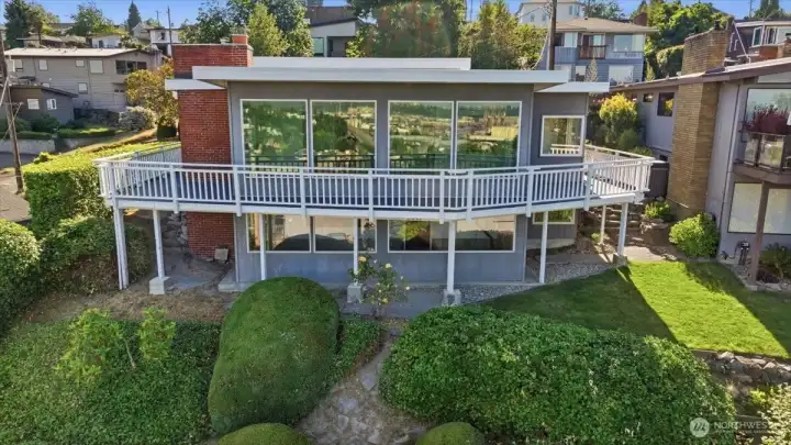 Expansive deck runs along the entire back of home, perfect for entertaining.