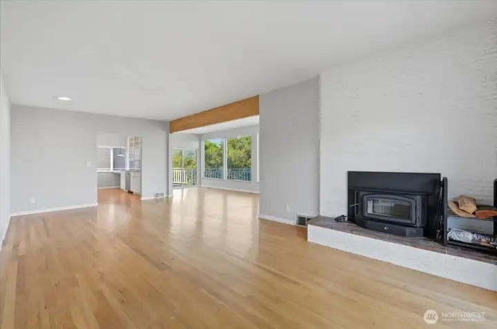 A fireplace with a white brick backdrop will bring warmth and ambiance to the room.