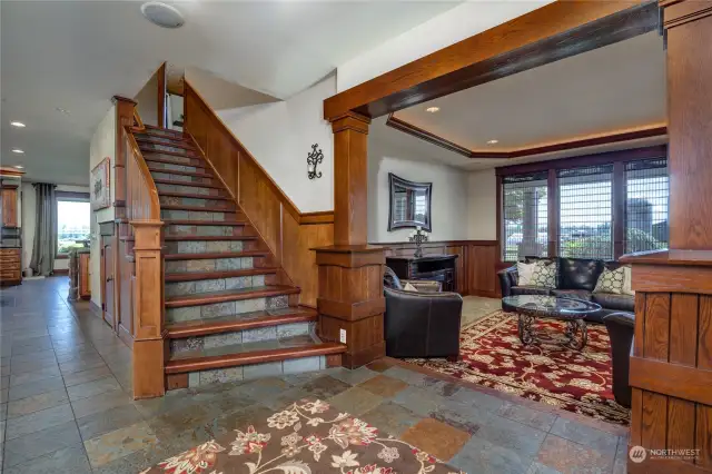 The entry flooring is slate tile, and the stairway to the second floor has wood framed steps with slate tread inserts.