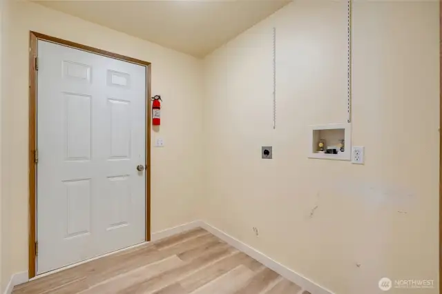 Laundry room leading out to garage
