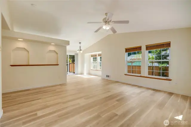 Bright, open living room upon entry.