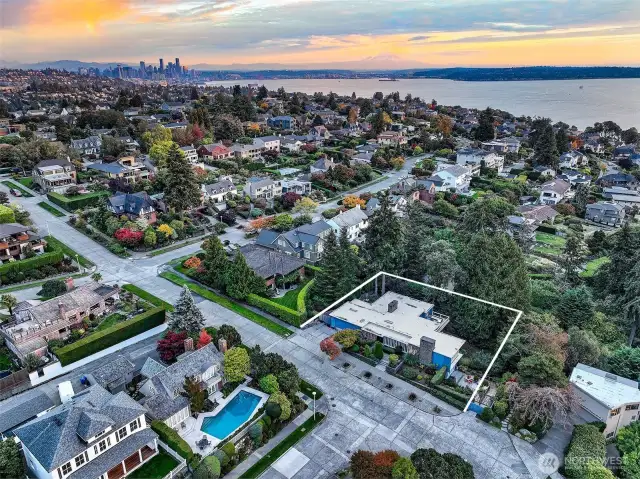 Set high on Magnolia Bluff in the Gold Coast of Carleton Park, 4221 W Armour occupies a prized 13,348 SF corner parcel. Surrounded by storied estates and framed by Puget Sound and Olympic Mountain views, this mid-century compound enjoys a rare balance of privacy, prestige, and proximity—just blocks to Discovery Park and minutes to downtown Seattle.