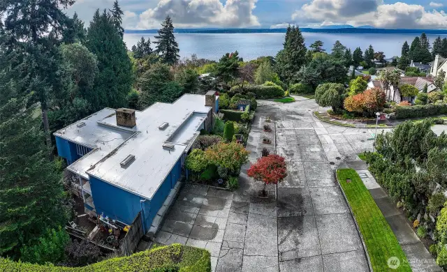 Looking northeast across Magnolia, 4221 W Armour nestles gracefully into its lush parcel—framed by the city skyline, Elliott Bay, and the undulating ridgeline of Queen Anne. This is Seattle at its most cinematic: a home at the meeting point of nature, architecture, and the ever-changing sky.