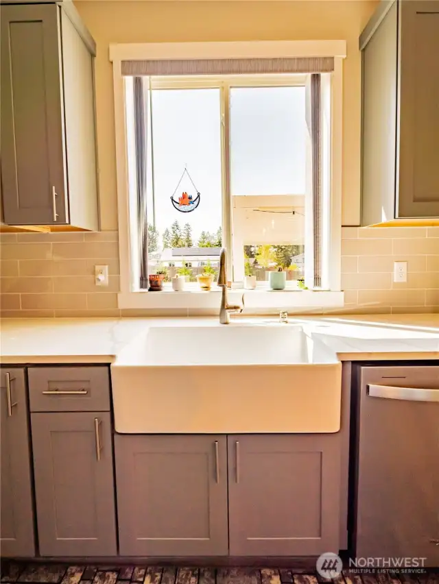 UPGRADED FARM SINK...WINDOW OVERLOOKS BEAUTY BACKYARD...YOU'LL ALMOST ENJOY DOING THE DISHES