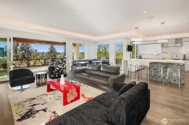 Family room with oversized sliders, stunning fireplace and accent lighting.
