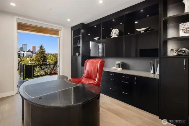Handsome office with double door entry, French doors with sweeping Downtown views and built-in shelving.