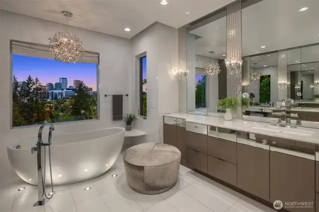 The bathroom is stunning custom chandeliers and floor lighting.