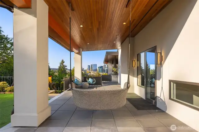 This quaint side patio is charming and is located off the family room. The ceilings on this overhang are so rich and beautiful.