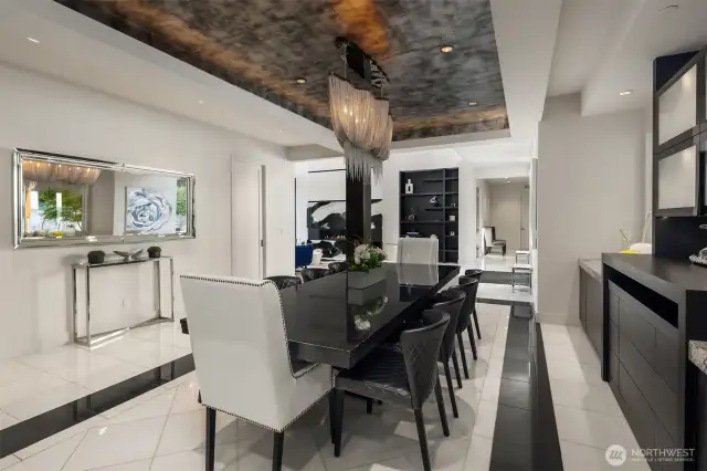 Dining room with beautiful ceiling detail, custom chandelier and built-in hutch.