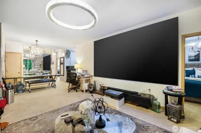 Another view of living room with 150 in TV (TV is available for purchase)