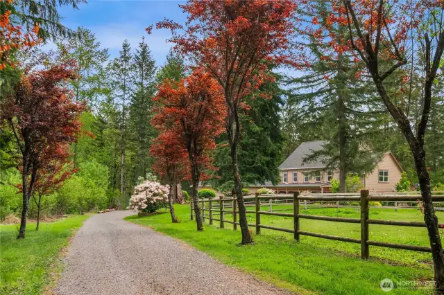 Circular driveway welcomes you to this beautiful countyry equestrian estate. Private setting, yet only 15 minutes to town and all amenities.