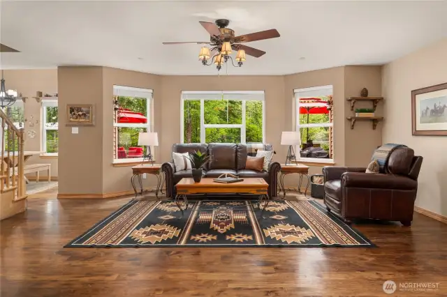 Spacious living room with hardwood floors.
