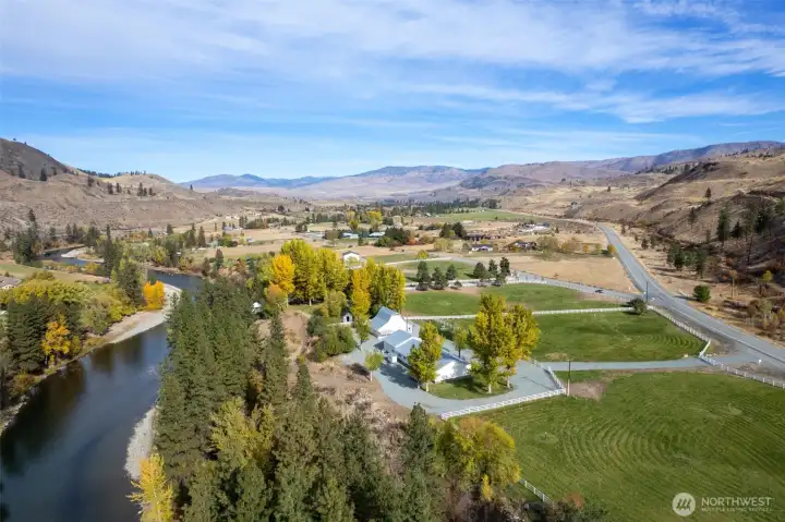 Looking upriver from above Marble Ranch—an extraordinary legacy property with sweeping Methow Valley vistas, fenced pasture, riverside forest, and room to live, work, and roam.