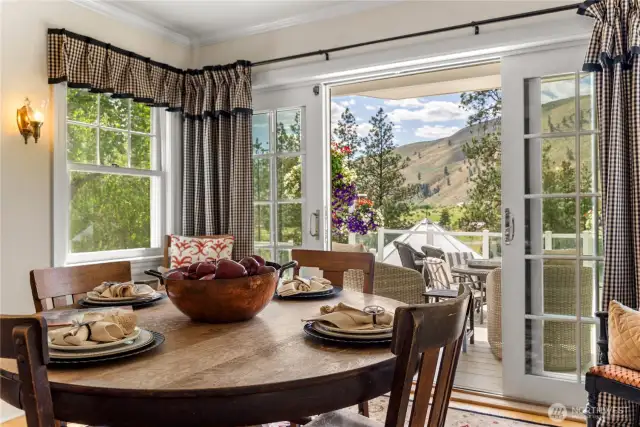 Enjoy every season from this cozy dining space—whether it's colorful summer blooms just outside the door or a winter wonderland straight from a Hallmark movie.