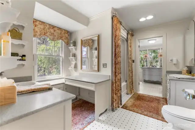 Elegant dressing room retreat with beadboard walls, vintage cabinetry, and serene views for peaceful mornings.