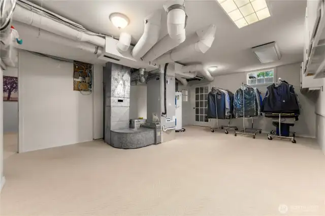 Spacious lower-level mechanical room with ample storage, hobby or gear space, and upgraded systems—functional flexibility for projects, organization, or seasonal prep.