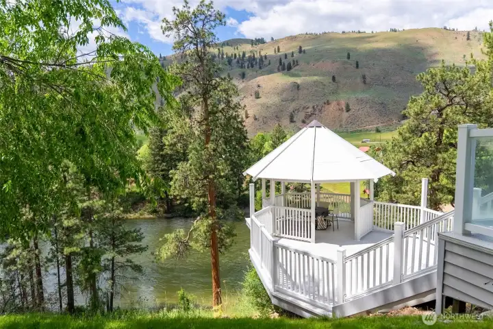 Serene riverside gazebo—your own private perch for morning coffee, stargazing, or simply soaking up the view.