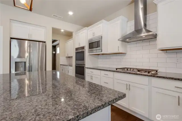 Kitchen leads to butler pantry and then off to the dining room