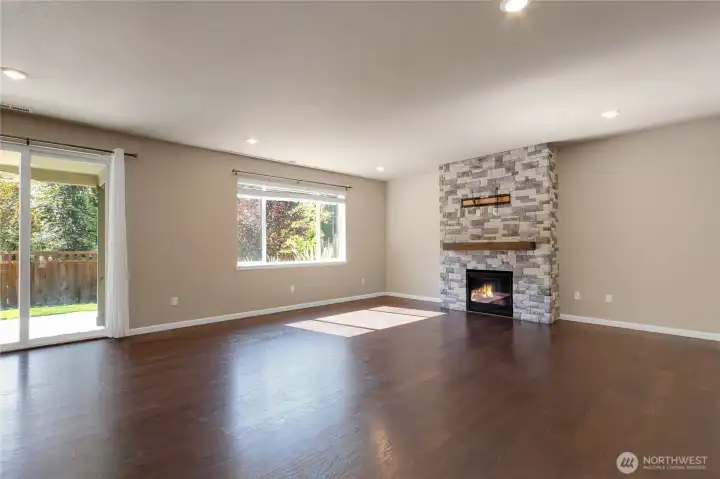 Living room. Patio slider leads out to you backyard