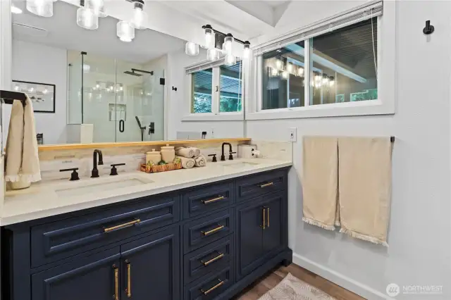 Downstairs remodeled bathroom with double sink and shower