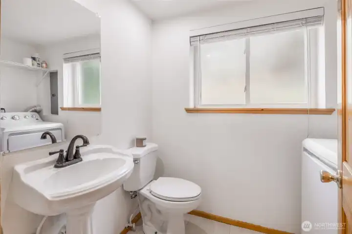Half bath and laundry room in basement