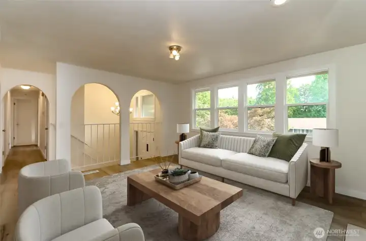 Main floor living room with abundant natural light.  Virtually staged