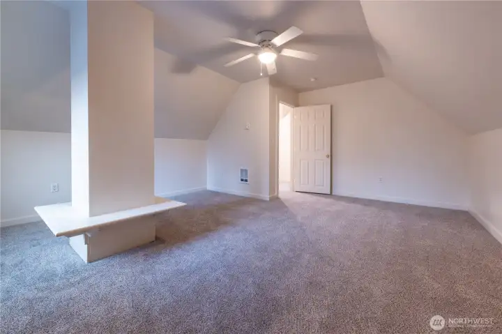 This fun, encased chimney stack, located in huge bedroom number three,  is wonderful to fluff with pillows, cushions, stuffed animals or your chotchskies.