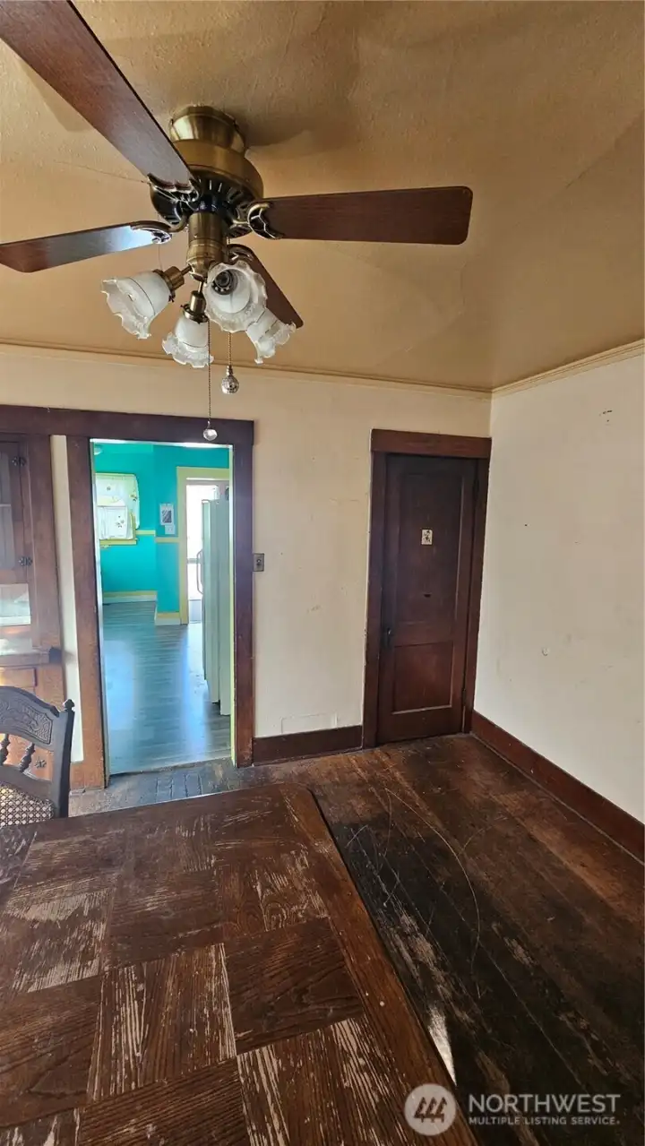 living room with wood floor and fan