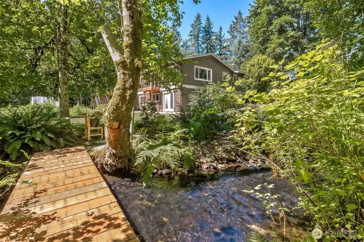 Your at-home retreat! Surrounded by Little Soos Creek which provides a pathway for nature: deer, otters, ducks, herons and even salmon in a good year!