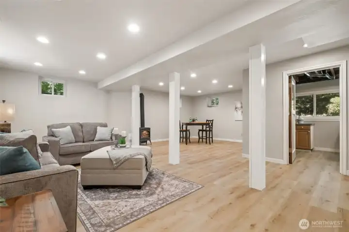 Here, you can see the rest of the room. - All the new flooring, fresh paint and bright lighting makes this such a cheerful space.