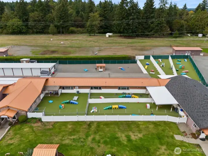 Outdoor dog play yards with k9 grass Astroturf, as well as sand play yards.