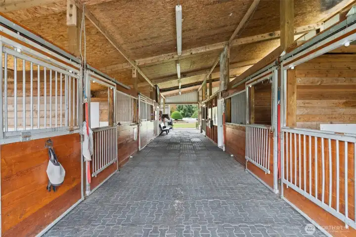 This thoughtfully designed space combines practicality with premium materials for a superior equestrian experience.
