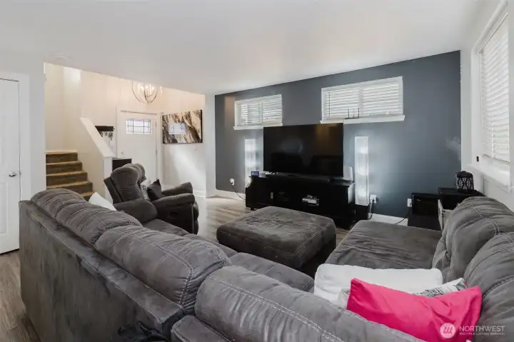 Living room looking toward the foyer and the stairs leading up to the bedrooms.