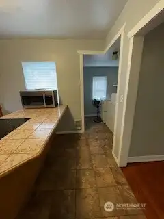 Kitchen view into laundry room