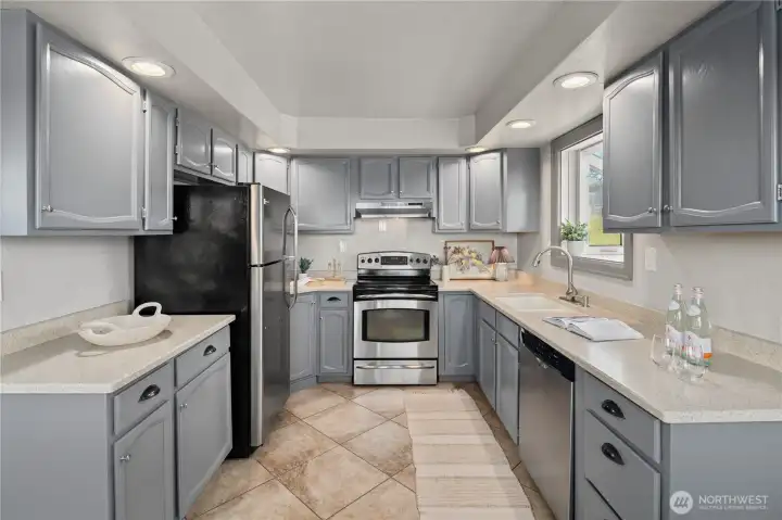Updated kitchen with beautiful Corian Countertops