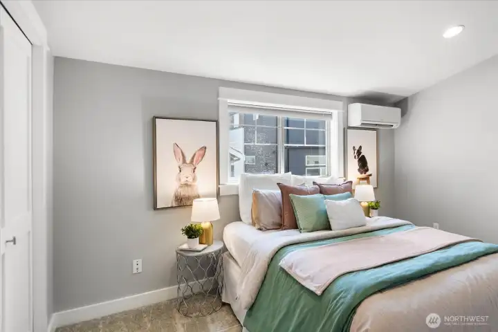 1 of 2 upstairs bedrooms with vaulted ceilings