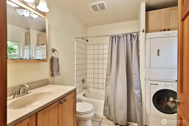 Functional full bath with washer and dryer. Functional full bath with washer and dryer.
