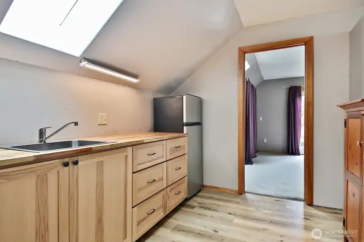 Upper level with kitchenette. Upper level with kitchenette.