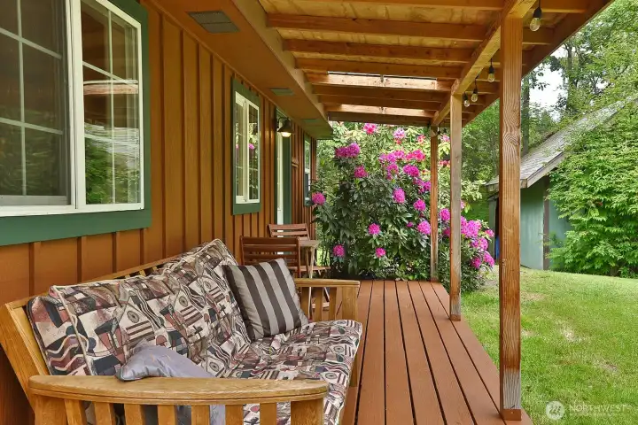 Enjoy peaceful mornings surrounded by nature on the spacious main level deck. Enjoy peaceful mornings surrounded by nature on the spacious main level deck.