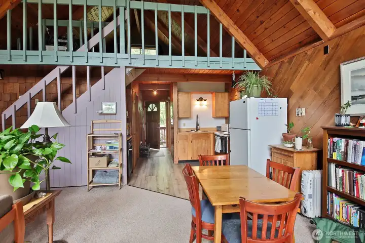 Guest house, upper level with loft. The dining area is open to the kitchen for easy flow gatherings and entertaining. Guest house, upper level with loft. The dining area is open to the kitchen for easy flow gatherings and entertaining.