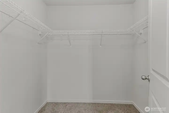 Primary bedroom walk-in closet
