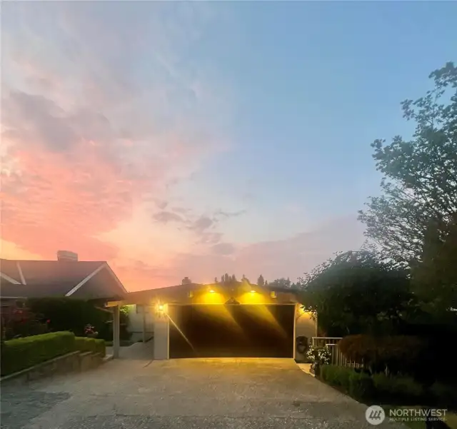 Street view of home is level, private and nicely unassuming.