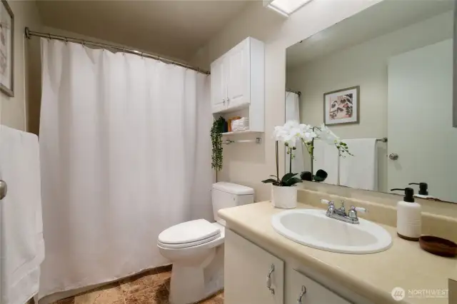 The full guest bath with the combination tub and shower provides versatility for owners/guests.