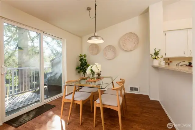 Spacious kitchen with pull up breakfast bar and newer Quartz counters.