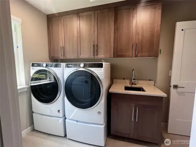 Actual Laundry Room shown.  Direct access from Primary to Laundry. Photos are for representational purposes only.  Colors and options may vary.