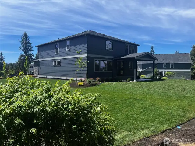 Backyard lawn. We landscaped1/3 of the acre with sprinklers! Photos are for representational purposes only.  Colors and options may vary.