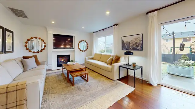 Big comfy family room.  Hard to tell from angle but both couches are equal size and 88 inches. Owner had a barrel chair at the end of each couch and space still felt open.